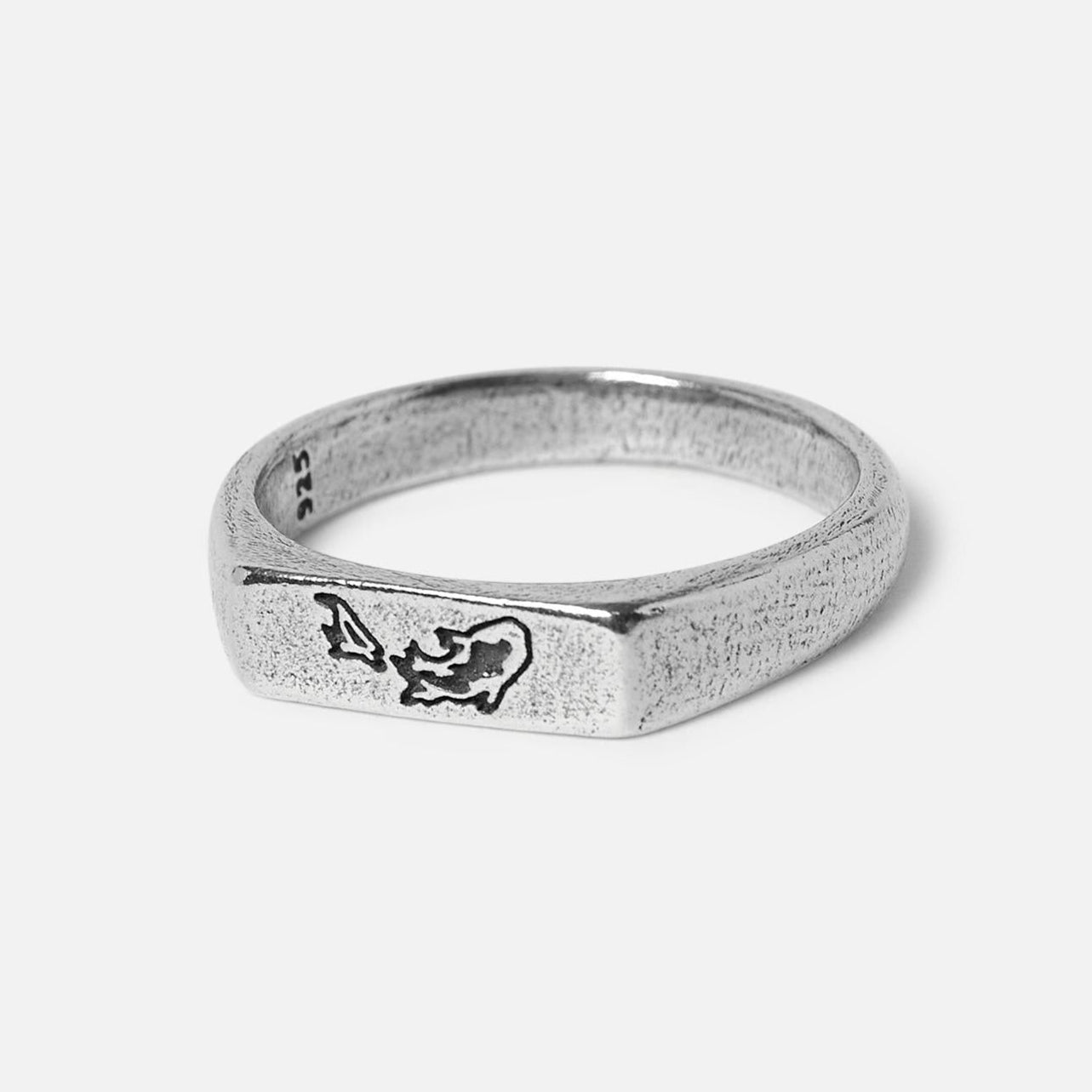 Studio image of silver ring on glossy white background v2