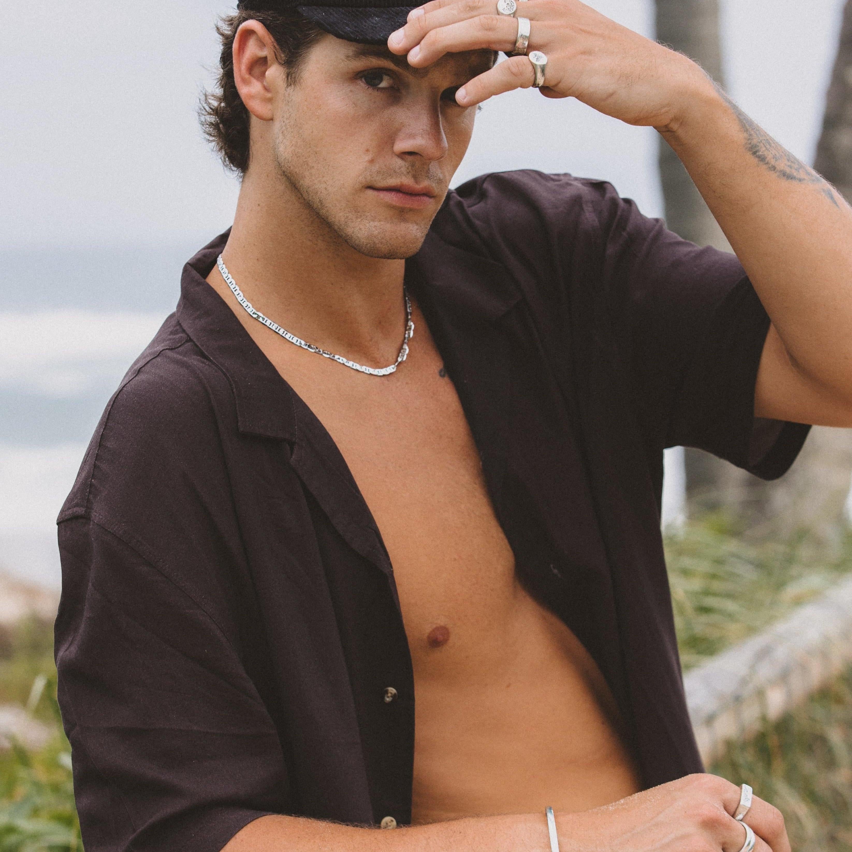 Model wearing Billie Jo rings paired with layered bracelets – contemporary style close-up.