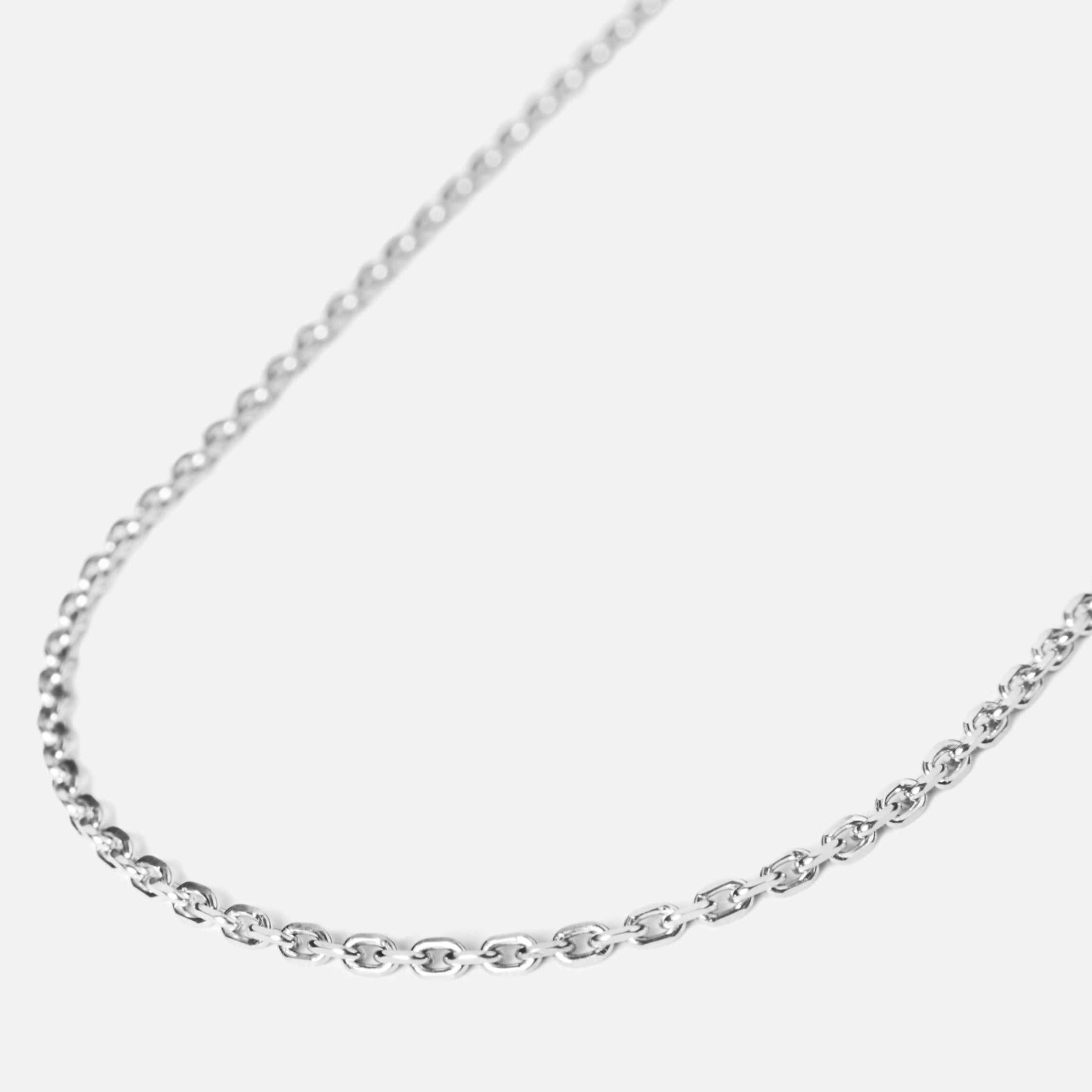 Gold rolo chain necklace displayed flat with soft shadows